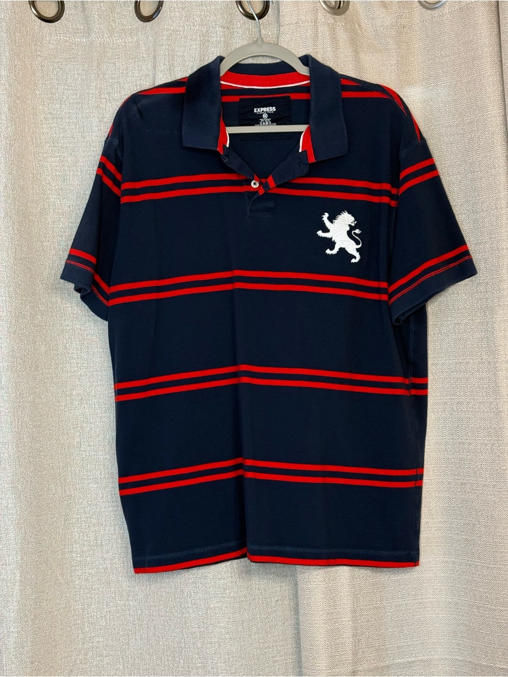 Express Men’s Navy Polo with Red Stripes and White Lion Patch